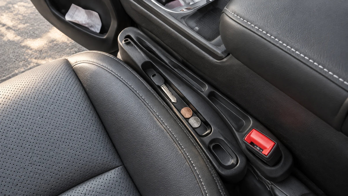 A photograph of the exact black flexible seat-gap car organizer from the reference, a slim contoured