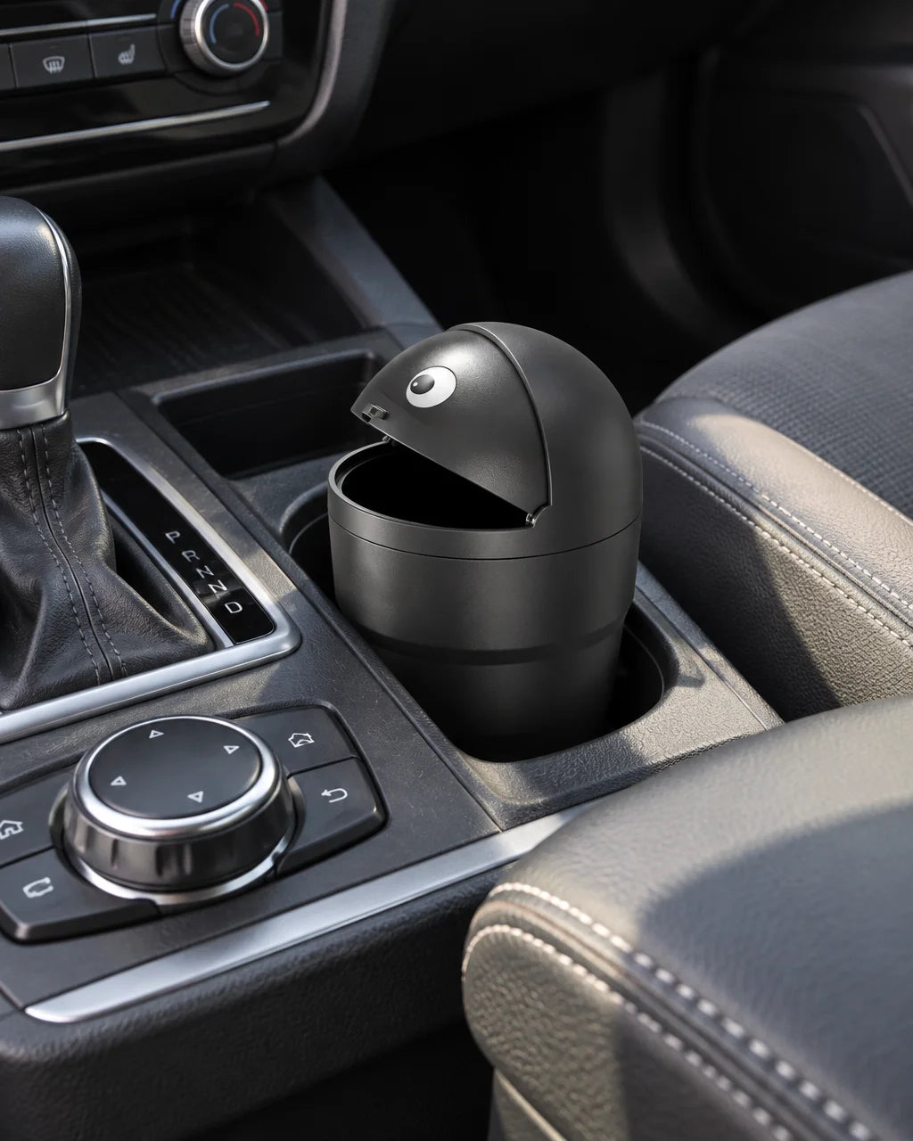 Show this exact compact covered car trash can placed in a suitable cup holder or bottle holder insid